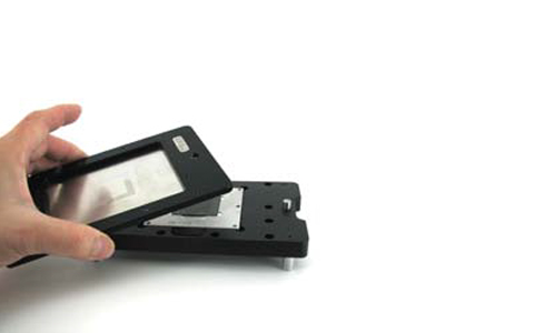 Fit printing frame with foil plate over the base assembly